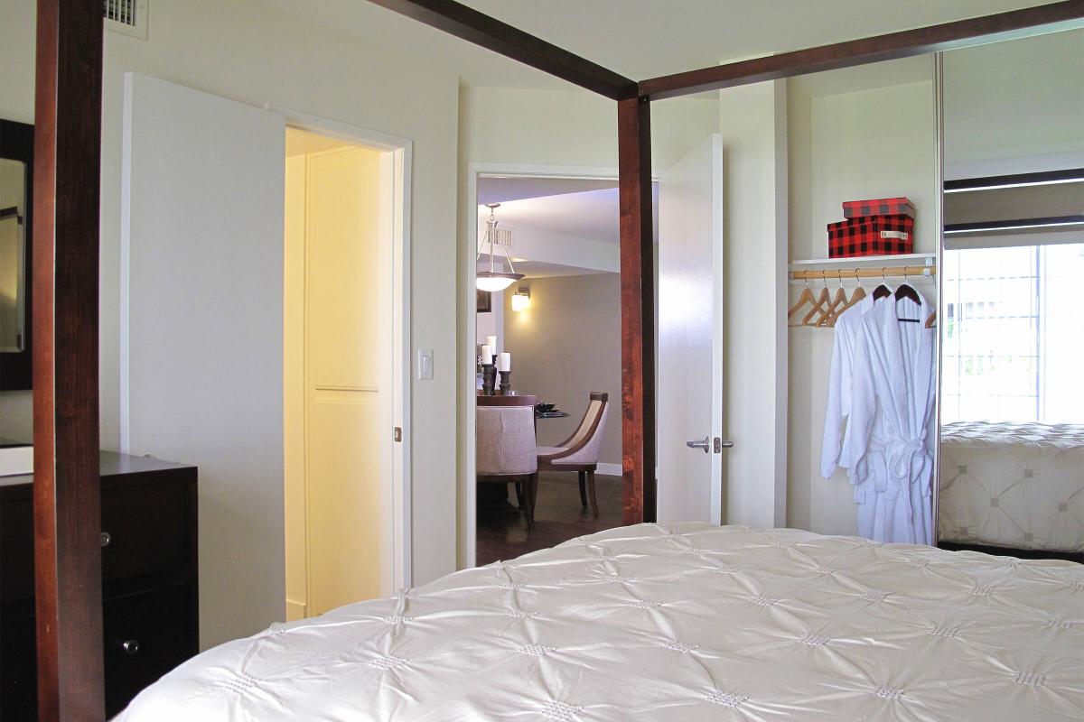 a large white bed in a bedroom
