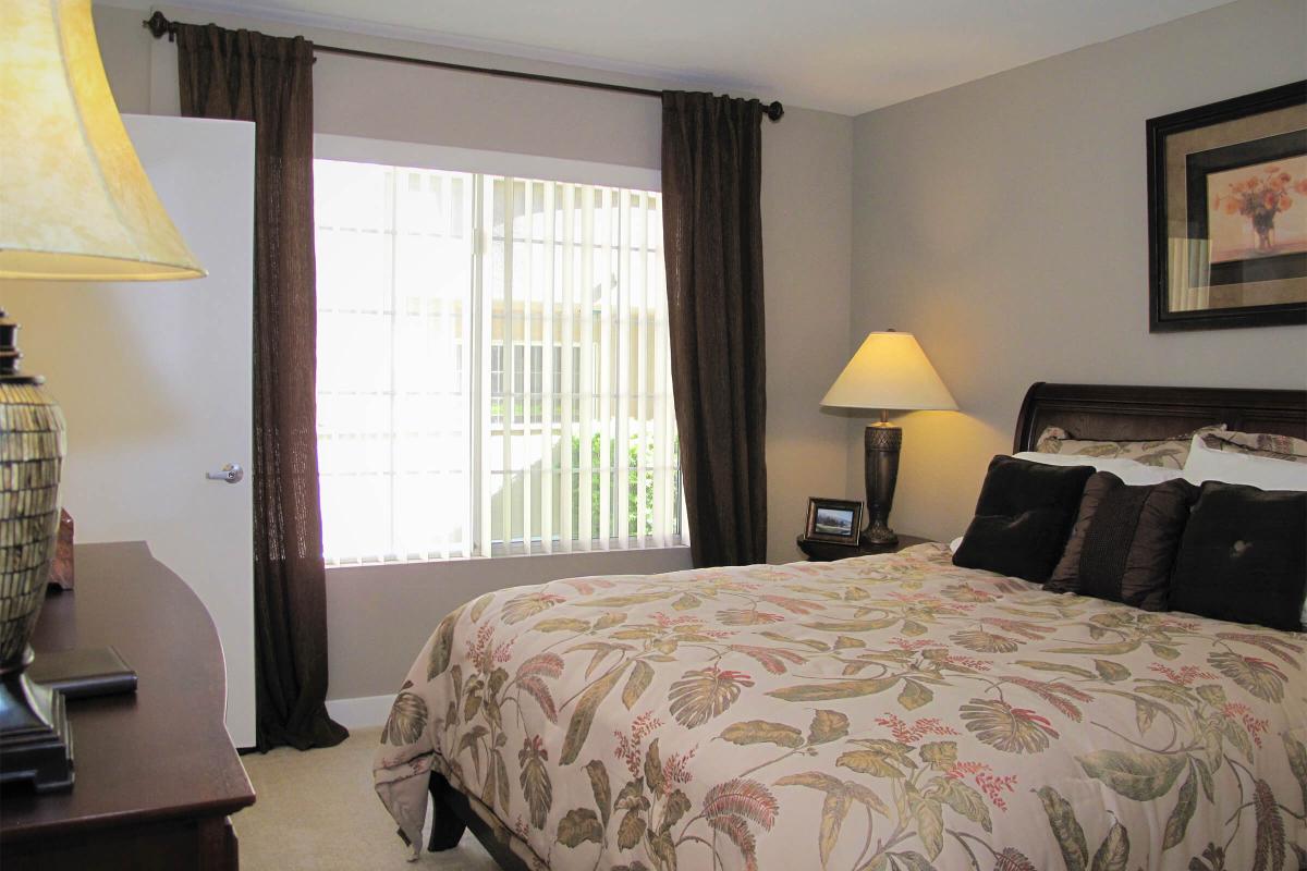 a bedroom with a large bed in a hotel room