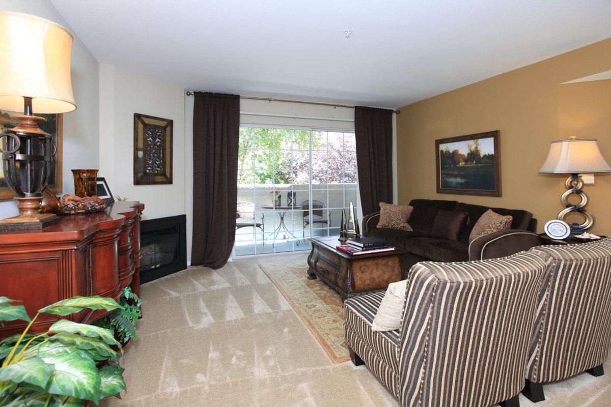 a living room filled with furniture and a flat screen tv