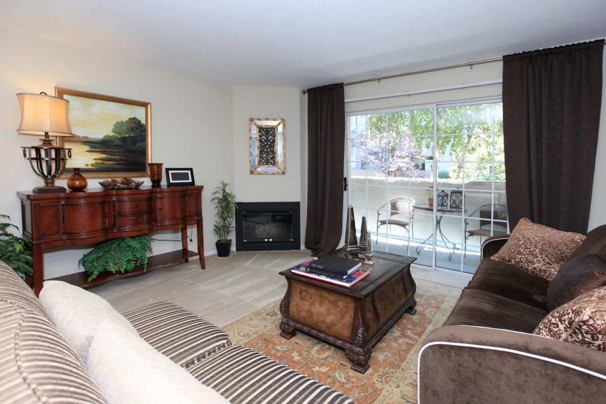 a living room filled with furniture and a flat screen tv