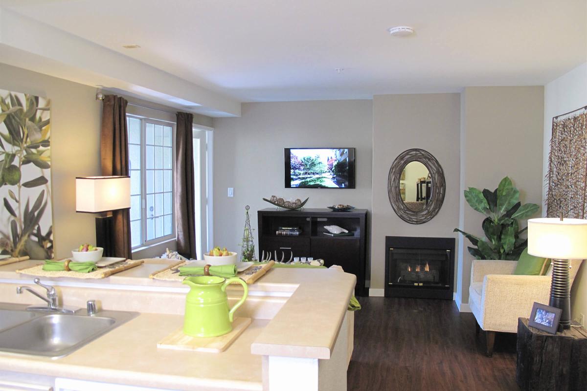 a living room filled with furniture and a flat screen tv