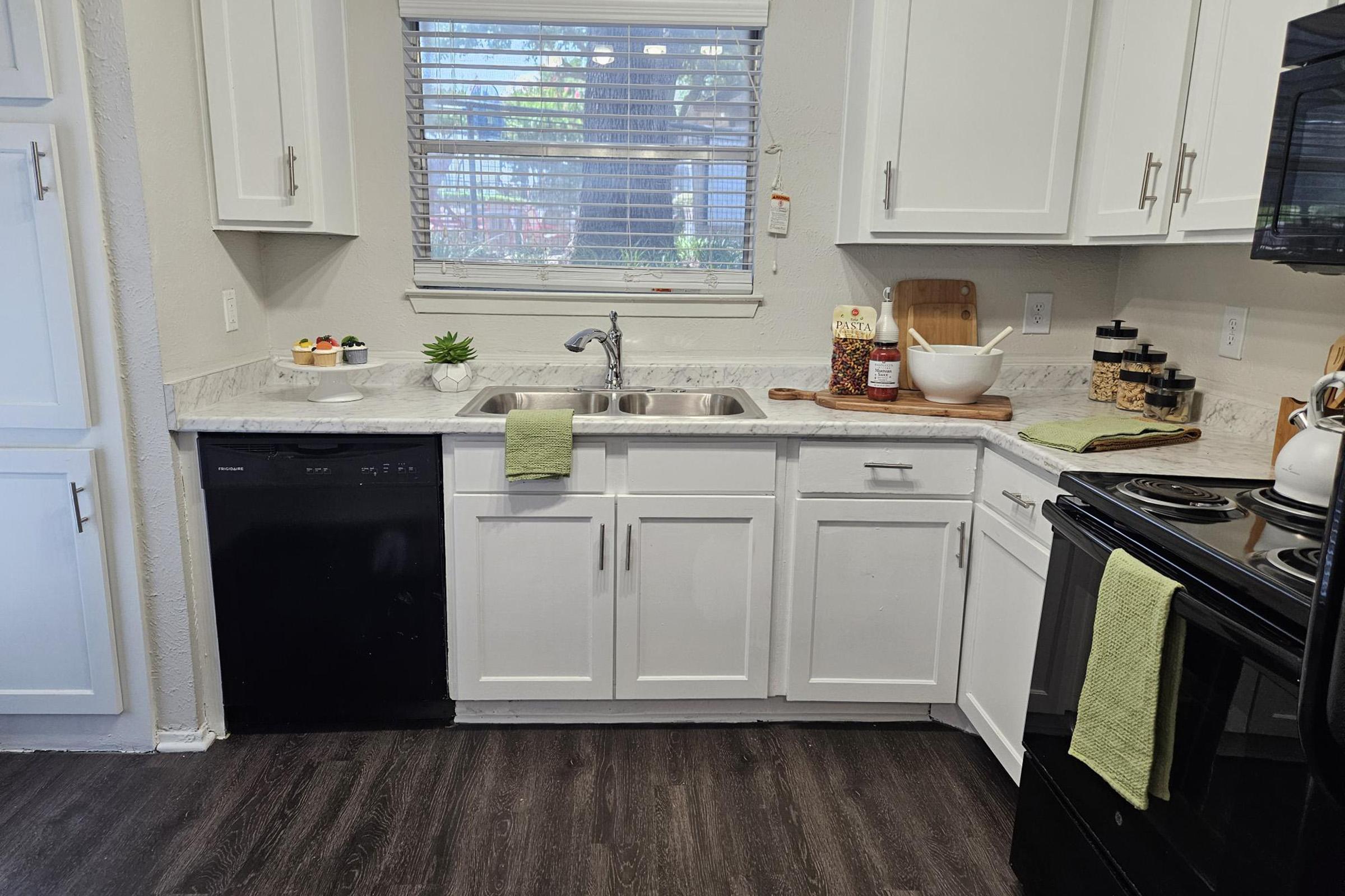 a kitchen with a sink and a window