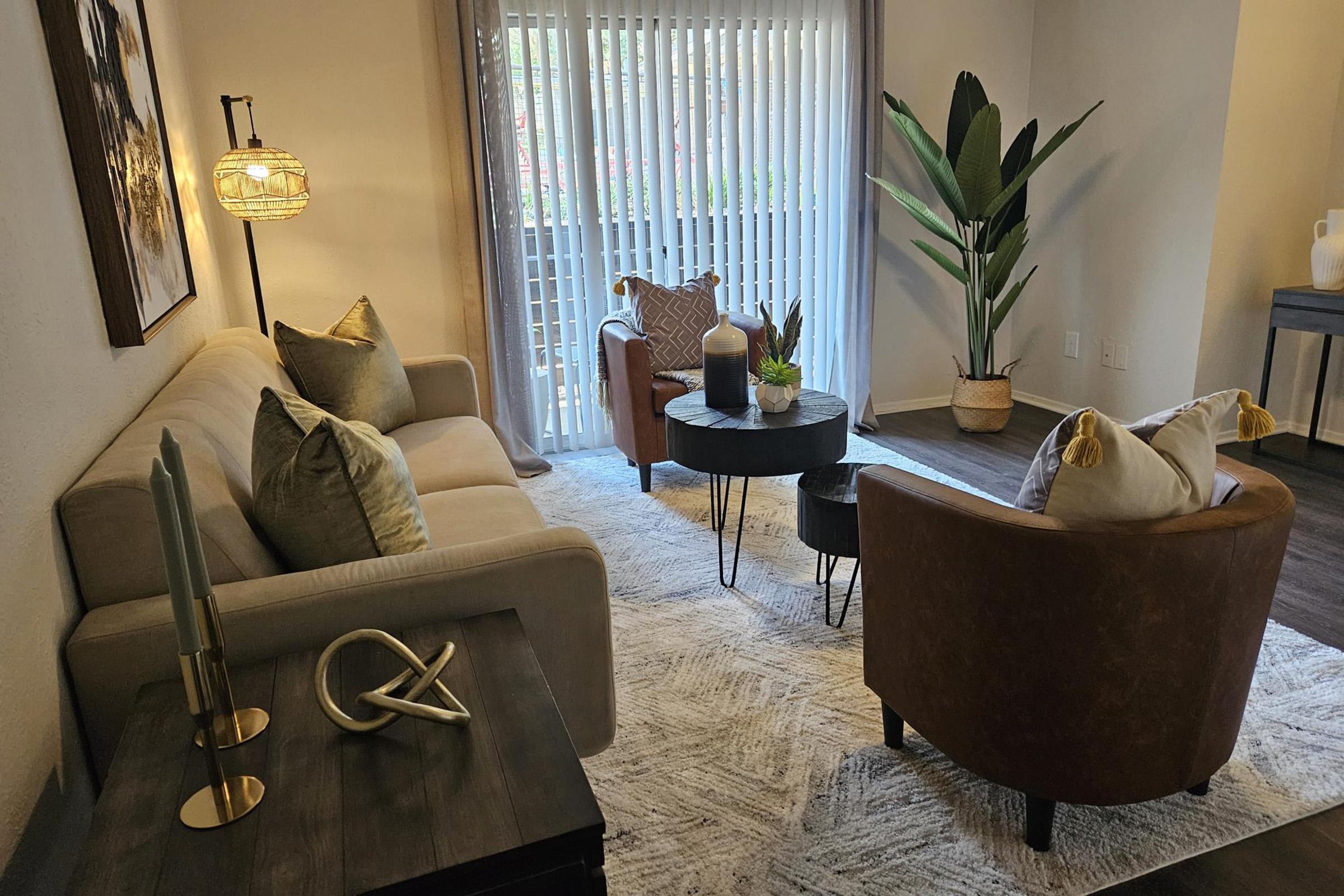 a living room filled with furniture and a fireplace