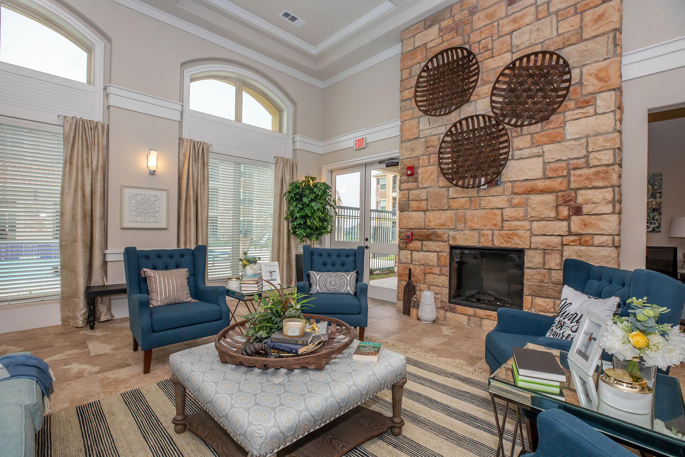 a living room filled with furniture and a fire place