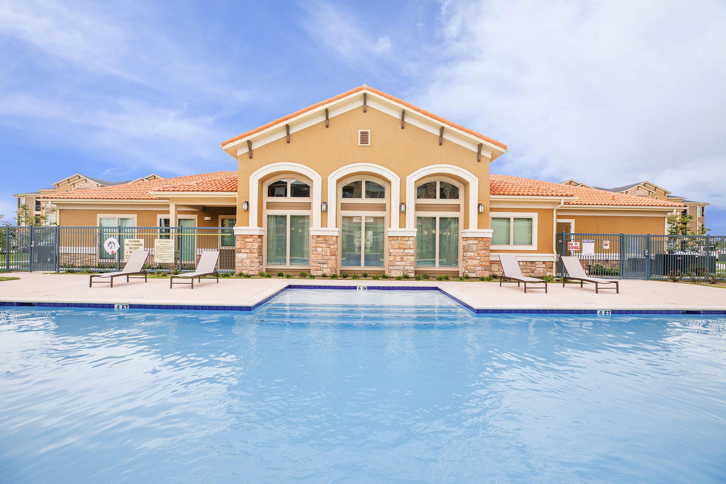 a large pool of water in front of a building