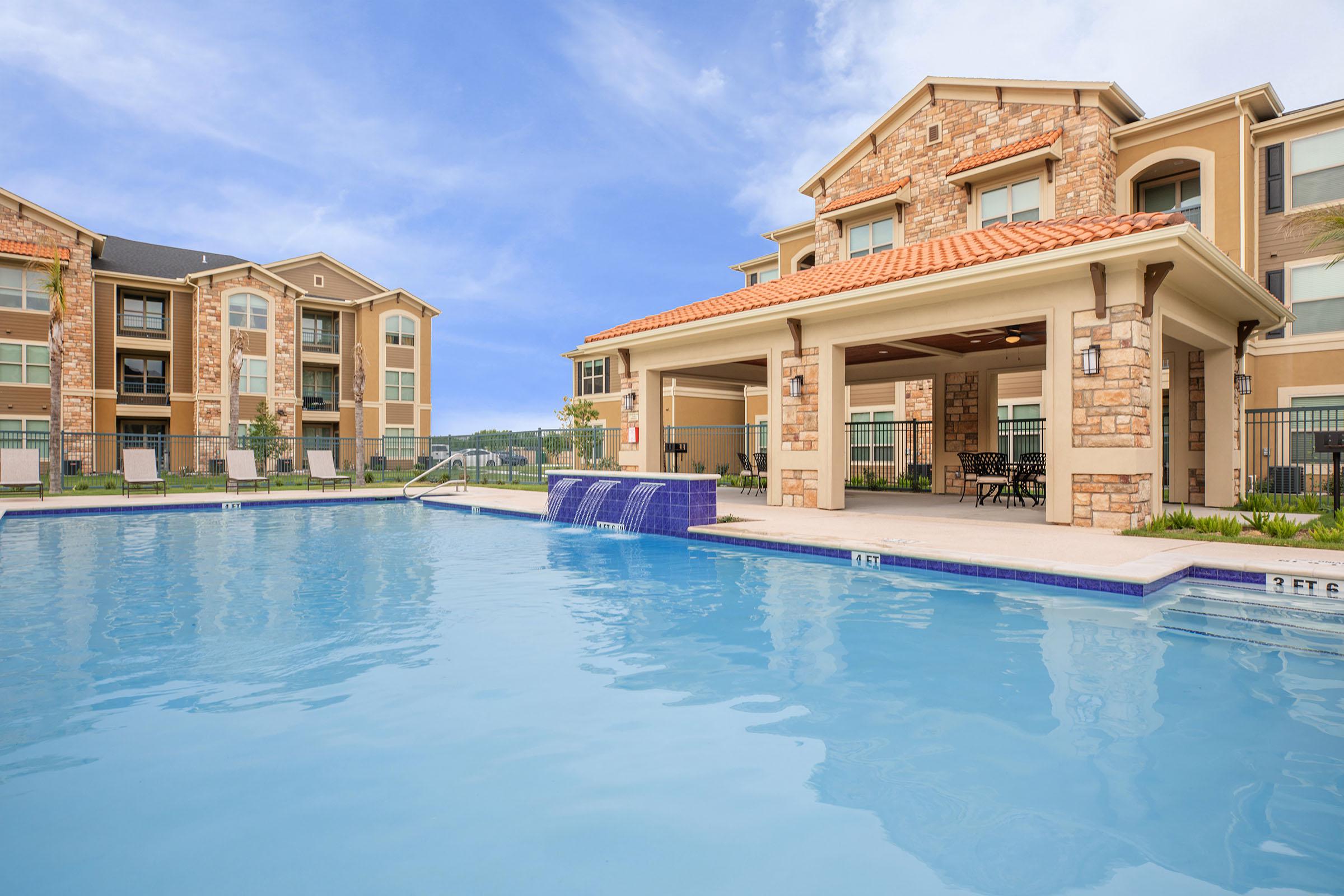 a large pool of water in front of a building