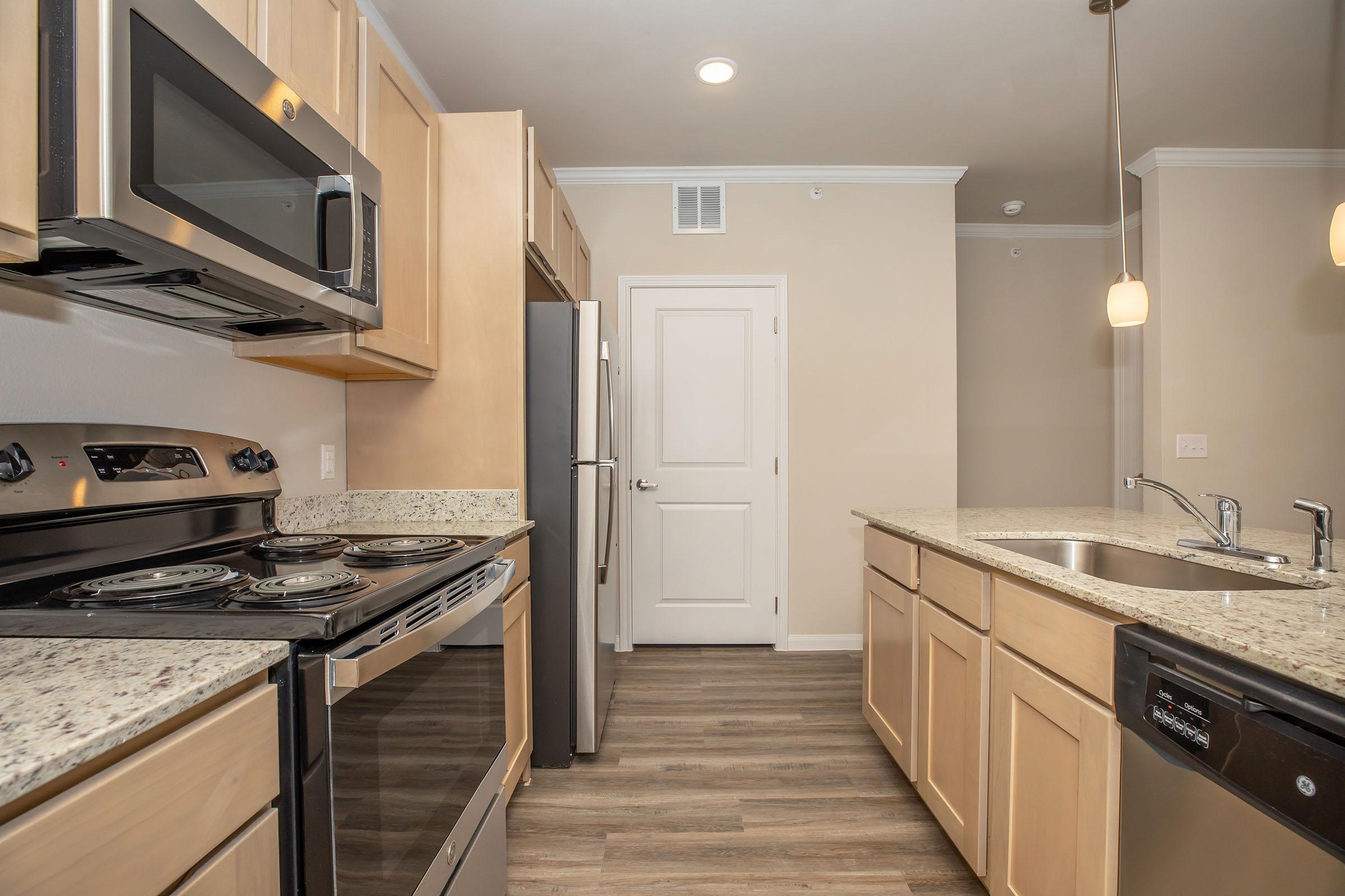 a kitchen with a stove and a sink