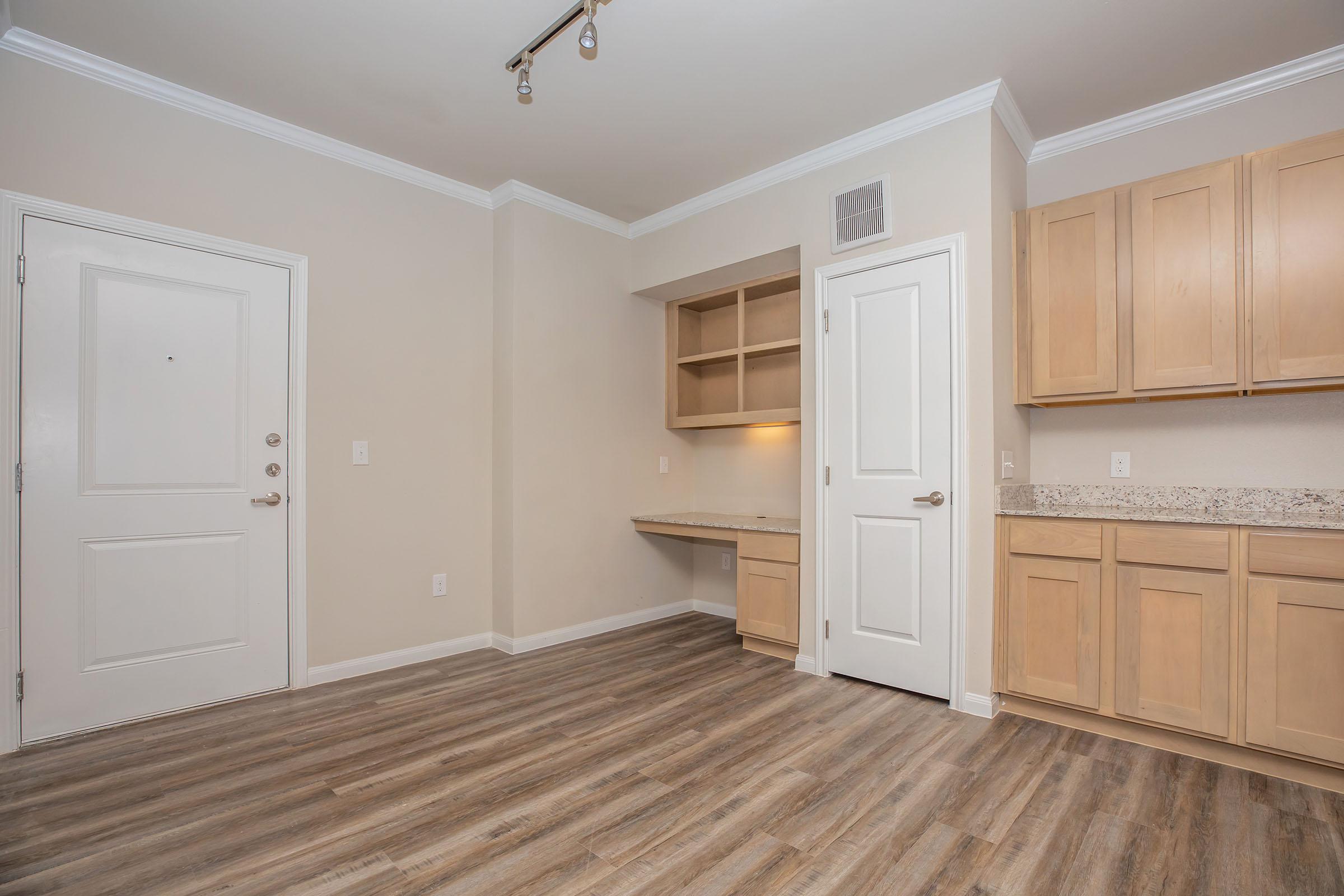 a kitchen with a wooden floor