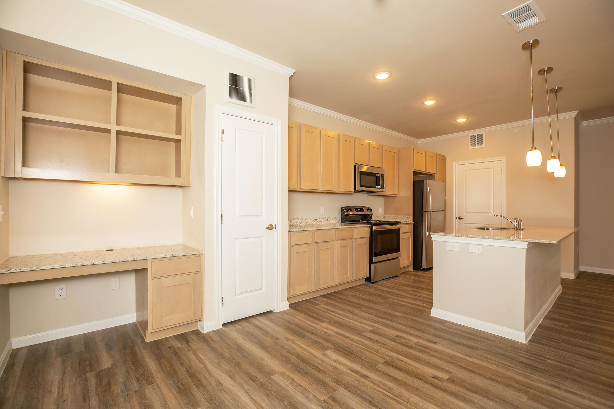 a kitchen with a wood floor