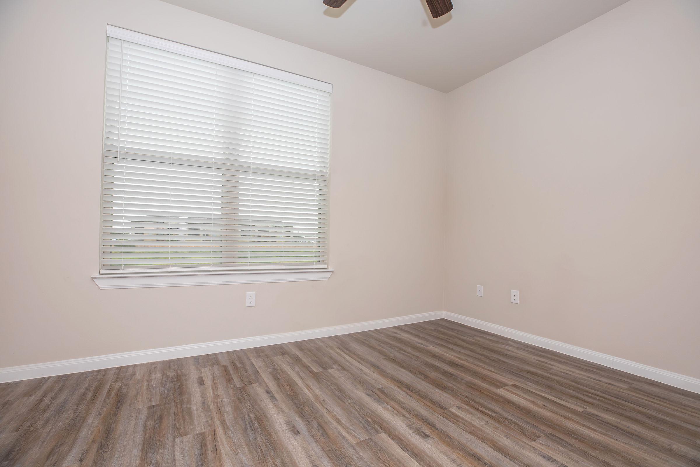 a bedroom with a large window