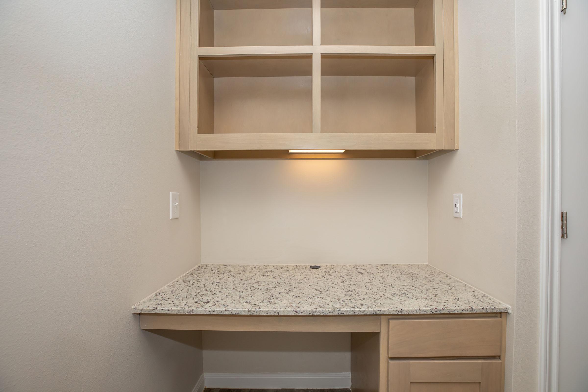 a kitchen with a sink and a mirror