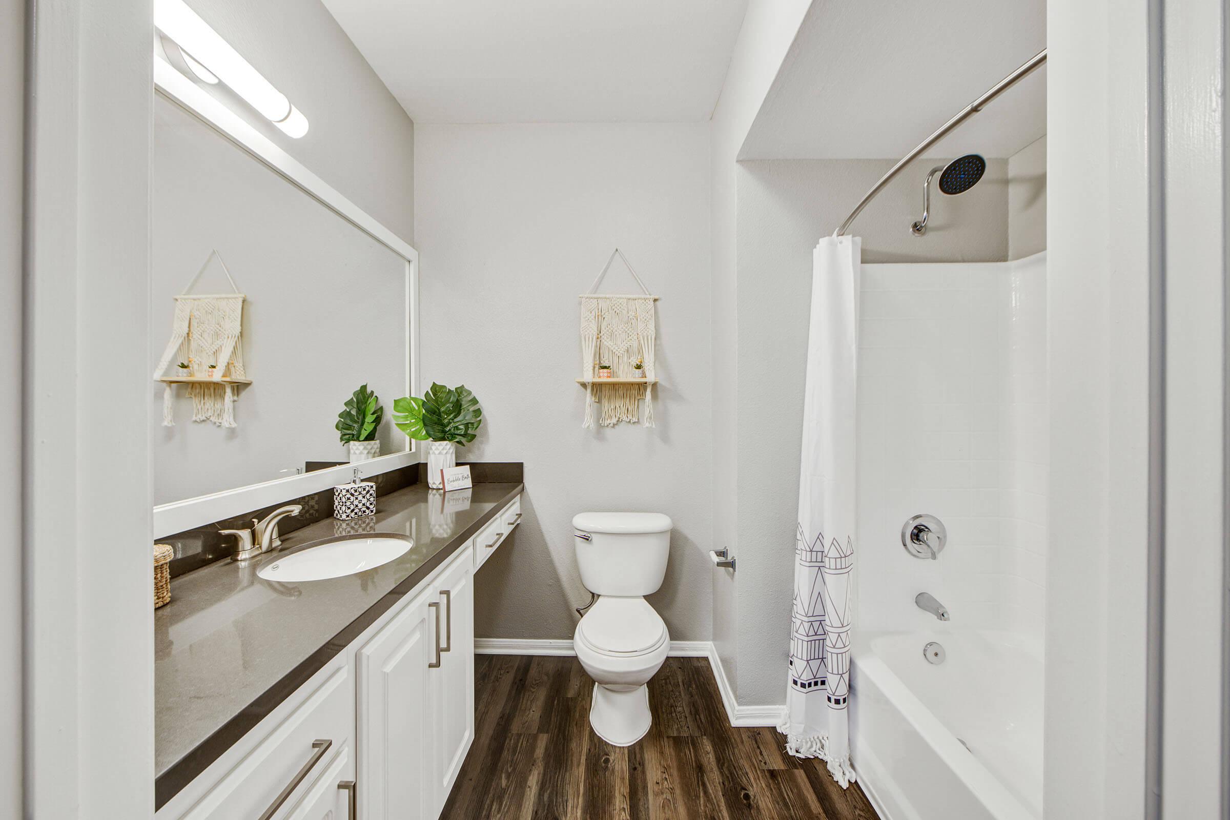 a kitchen with a sink and a mirror