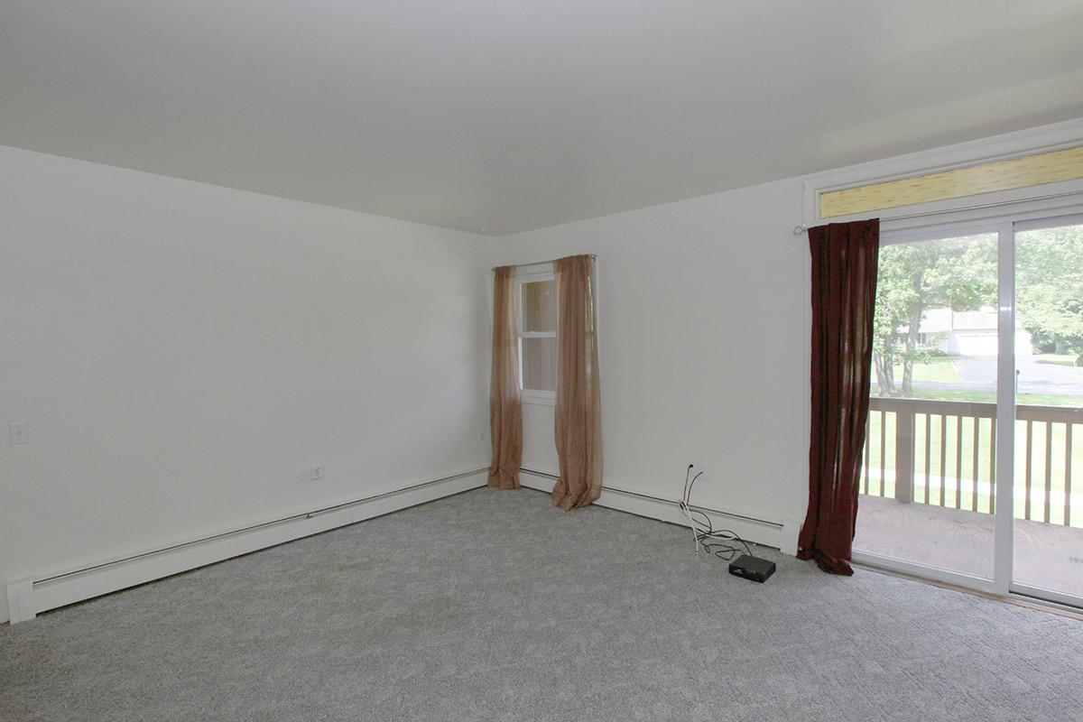 a bedroom with a bed in a room