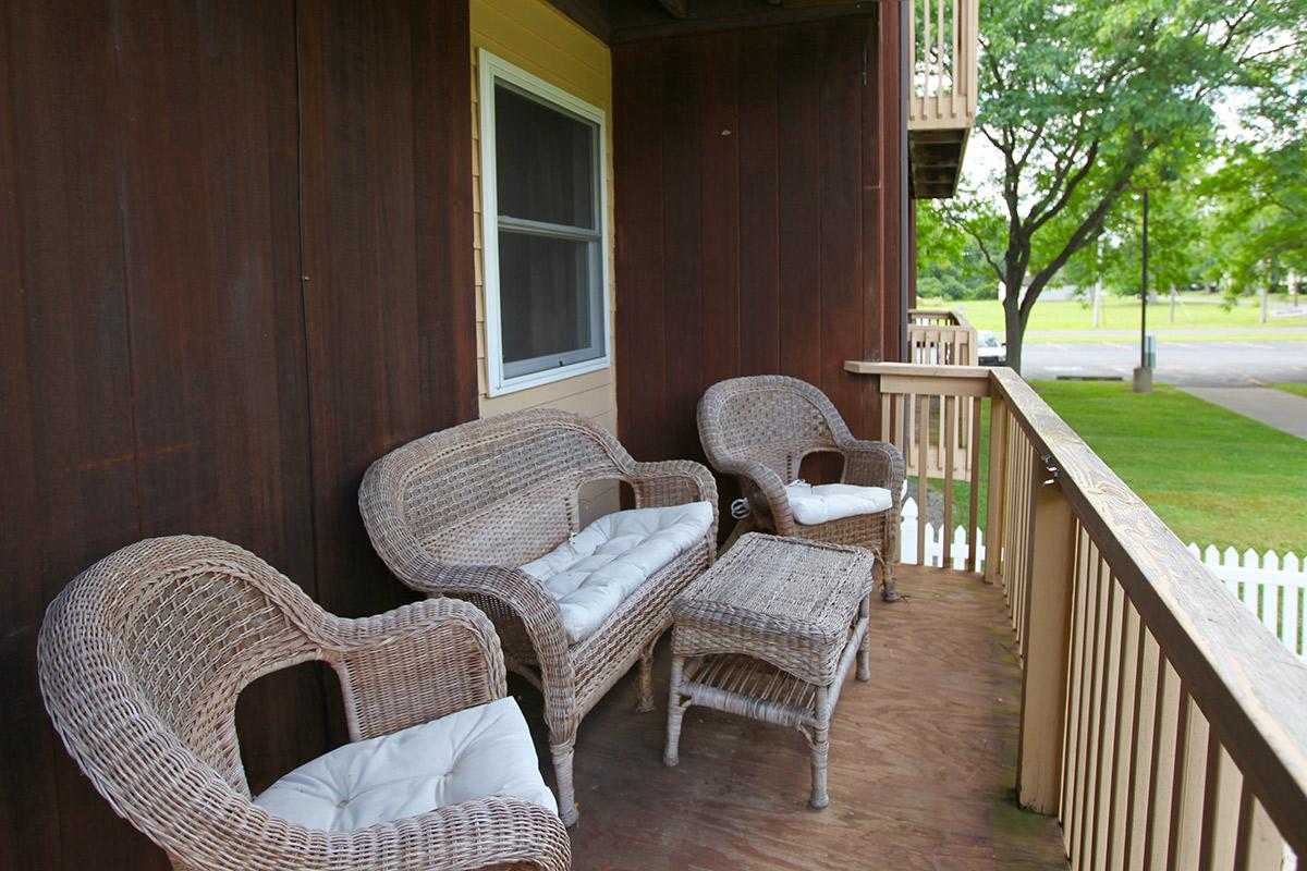 a chair sitting in front of a fence
