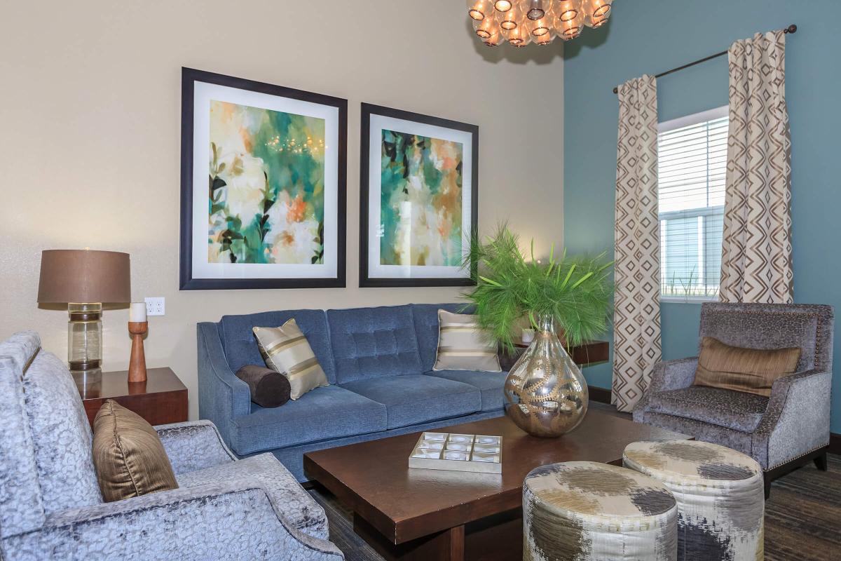 a living room filled with furniture and vase on a table