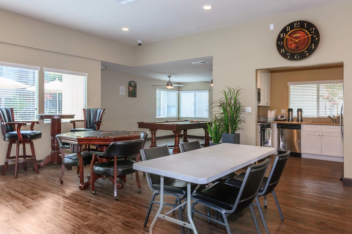 a living room filled with furniture and a large window