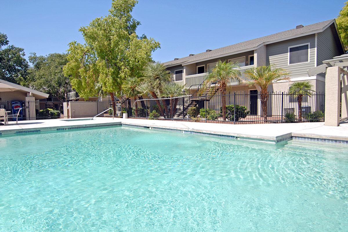 a large pool of water in front of a house