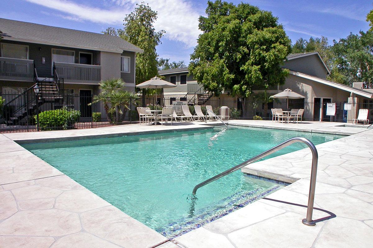 a house with a pool outside of a building