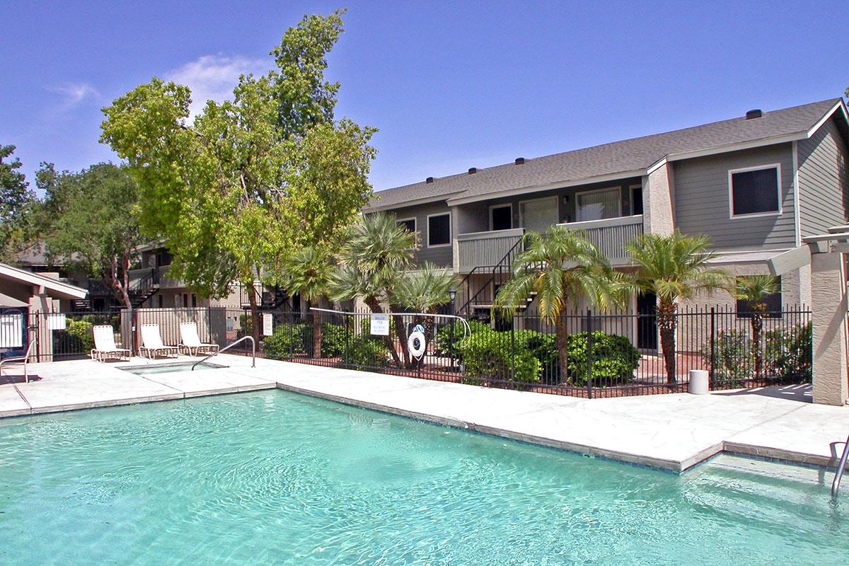 a large pool of water in front of a house