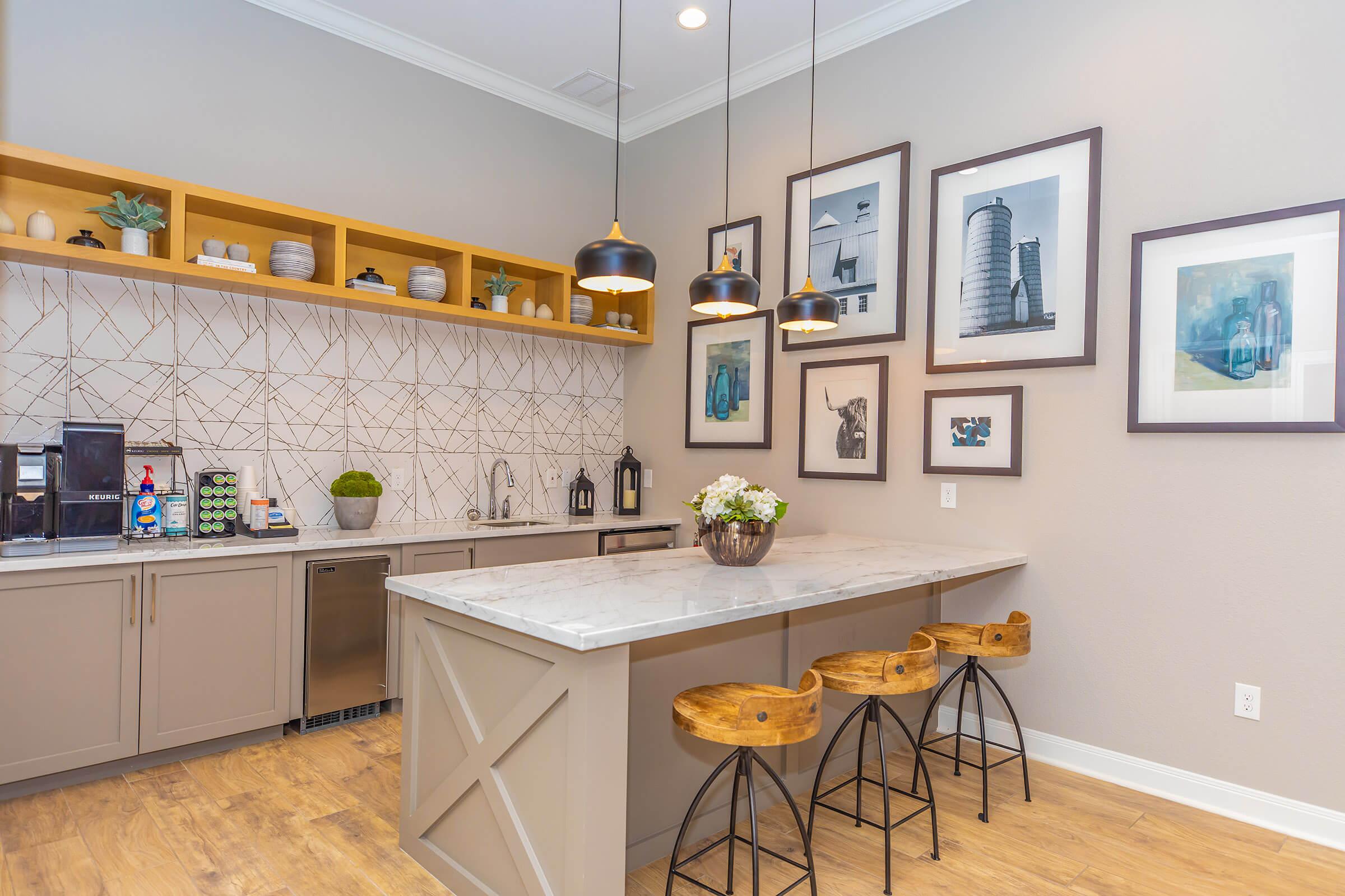 a kitchen with an island in the middle of a room