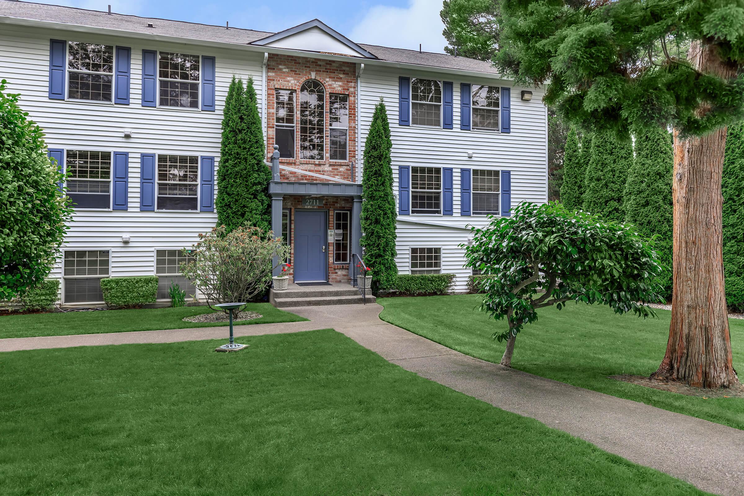 a large lawn in front of a house