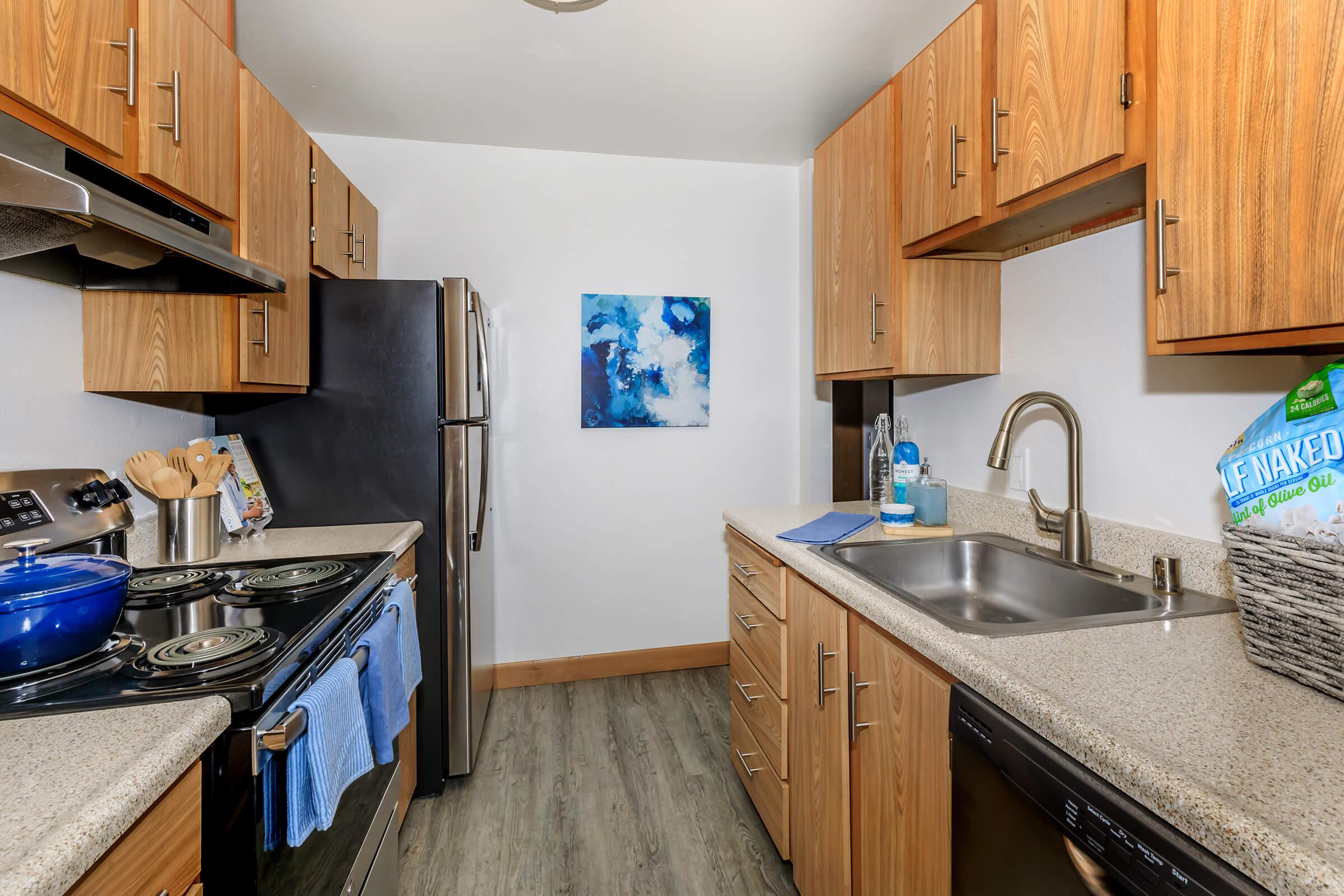 a kitchen with an island in the middle of a room