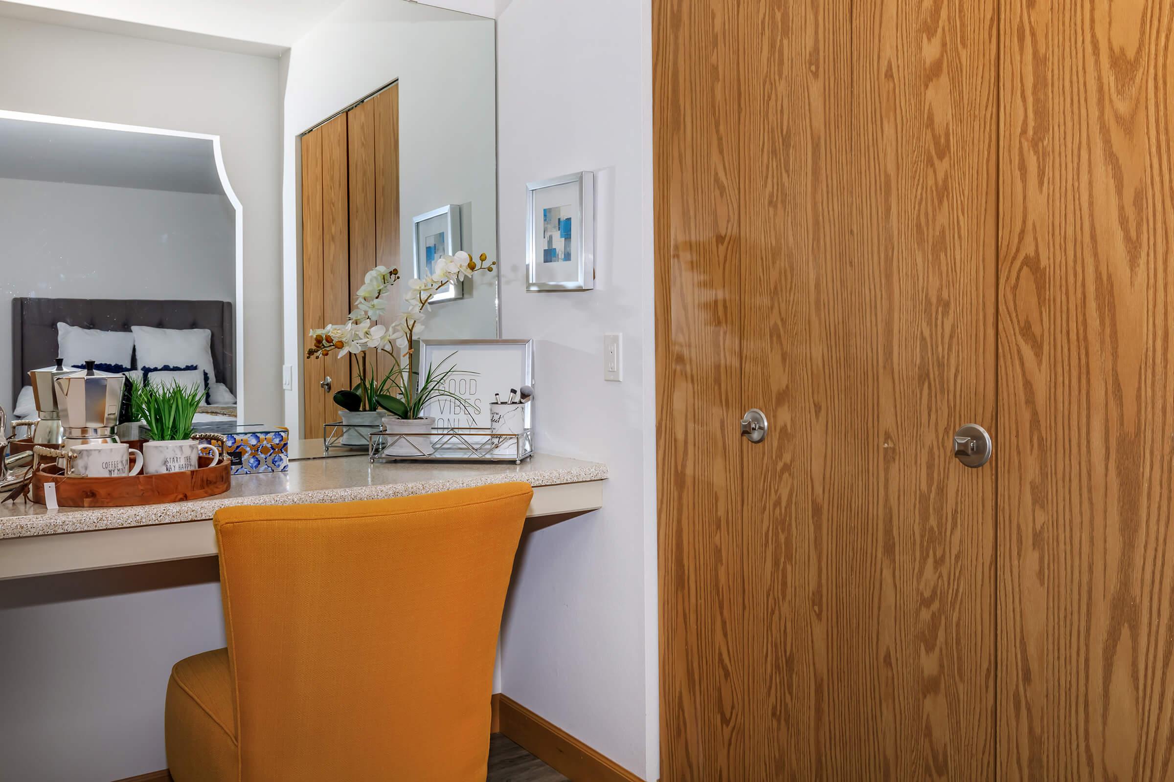 a kitchen with wooden cabinets and a sink