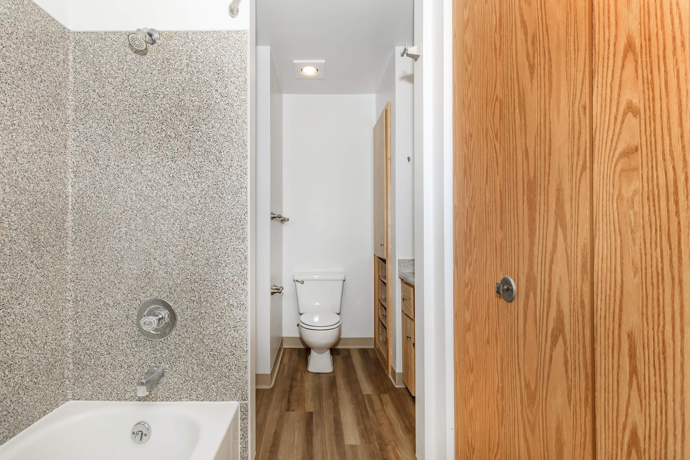 a close up of a door next to a shower