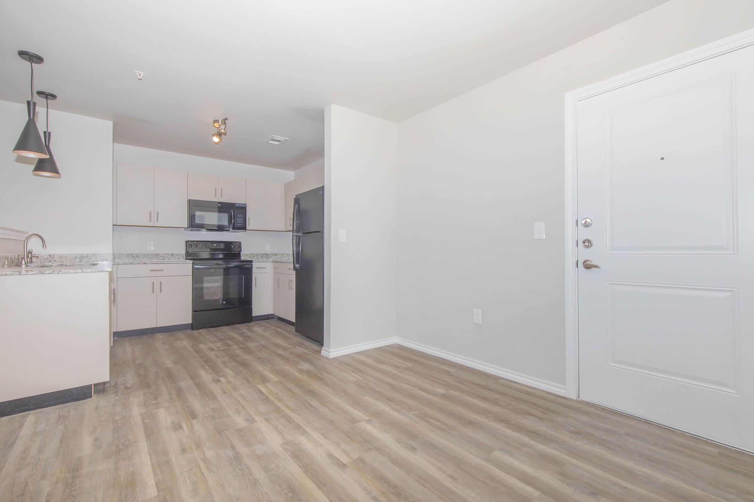 a kitchen with a stove and a refrigerator