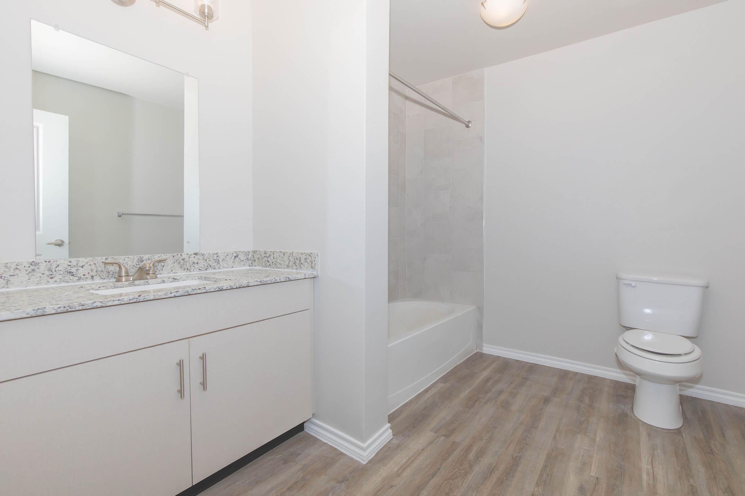 a kitchen with a sink and a mirror