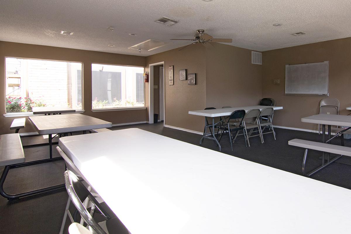 a room filled with furniture and a large window