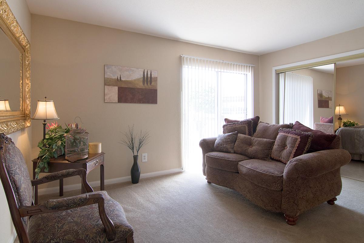 a living room filled with furniture and a fire place