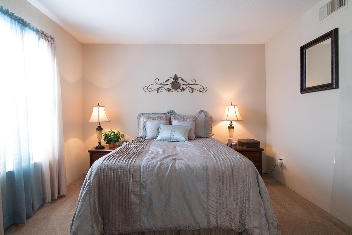 a bedroom with a bed in a hotel room