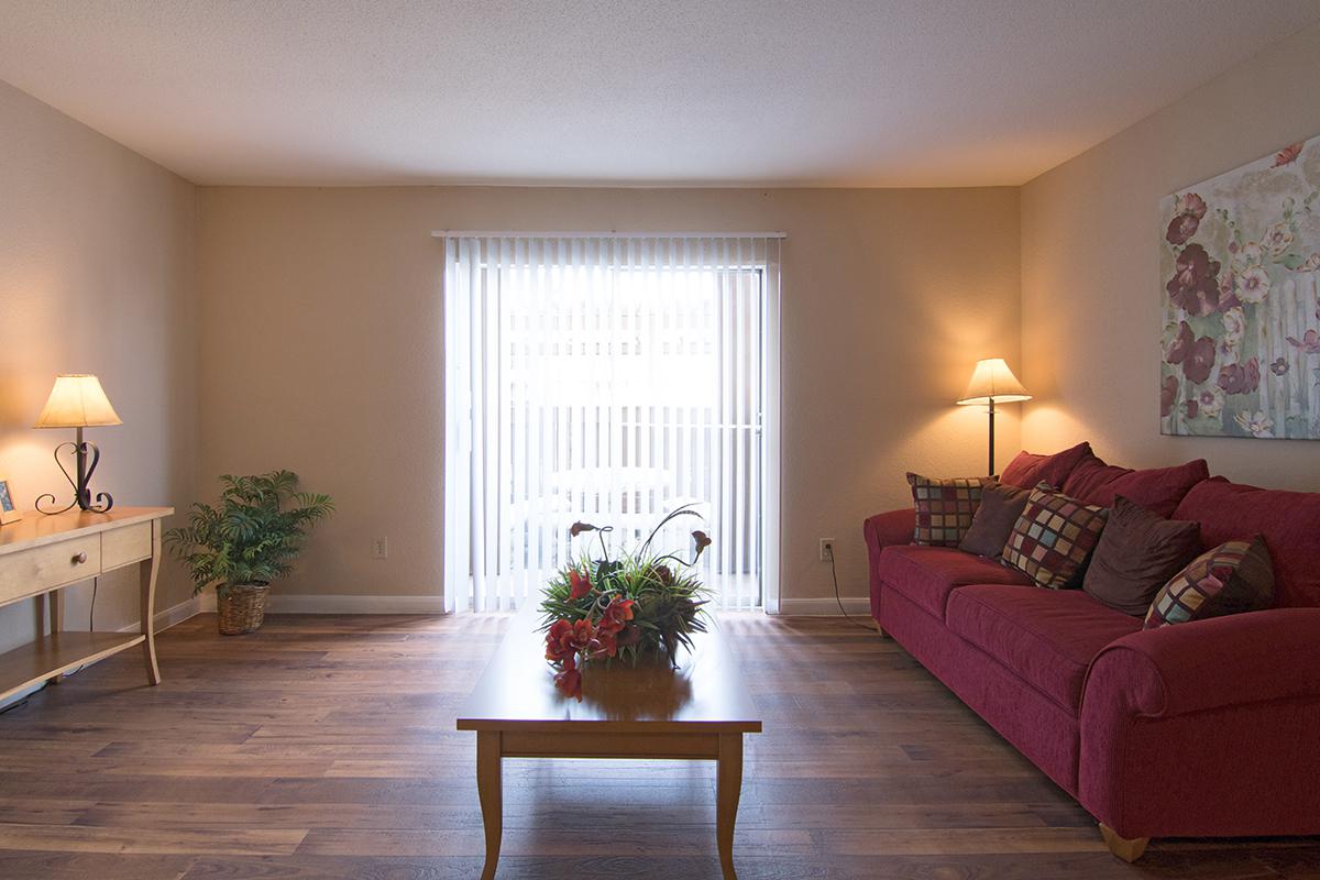 a living room filled with furniture and a fire place