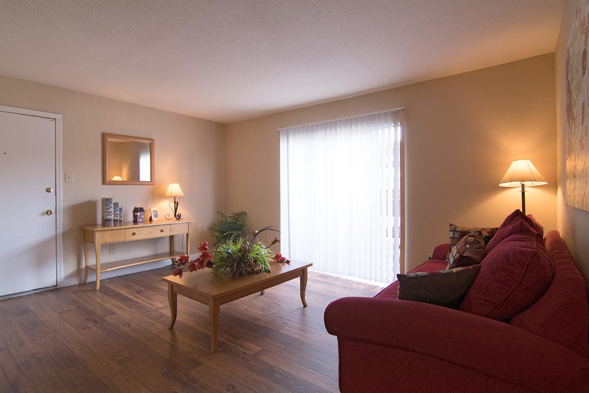 a living room filled with furniture and a flat screen tv