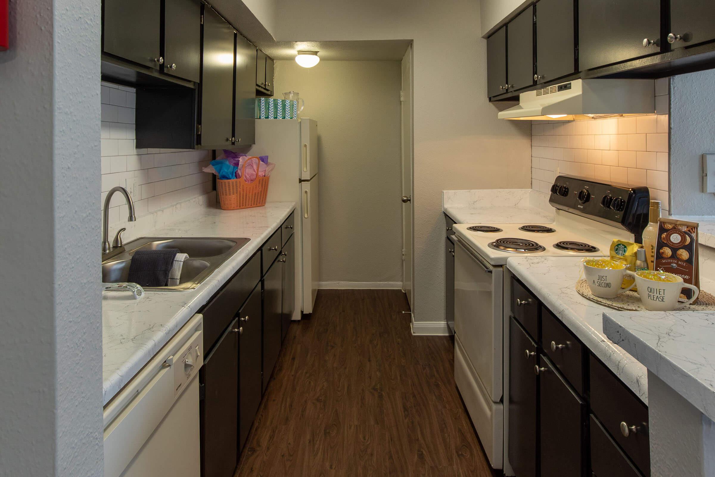 a kitchen with a stove and a sink