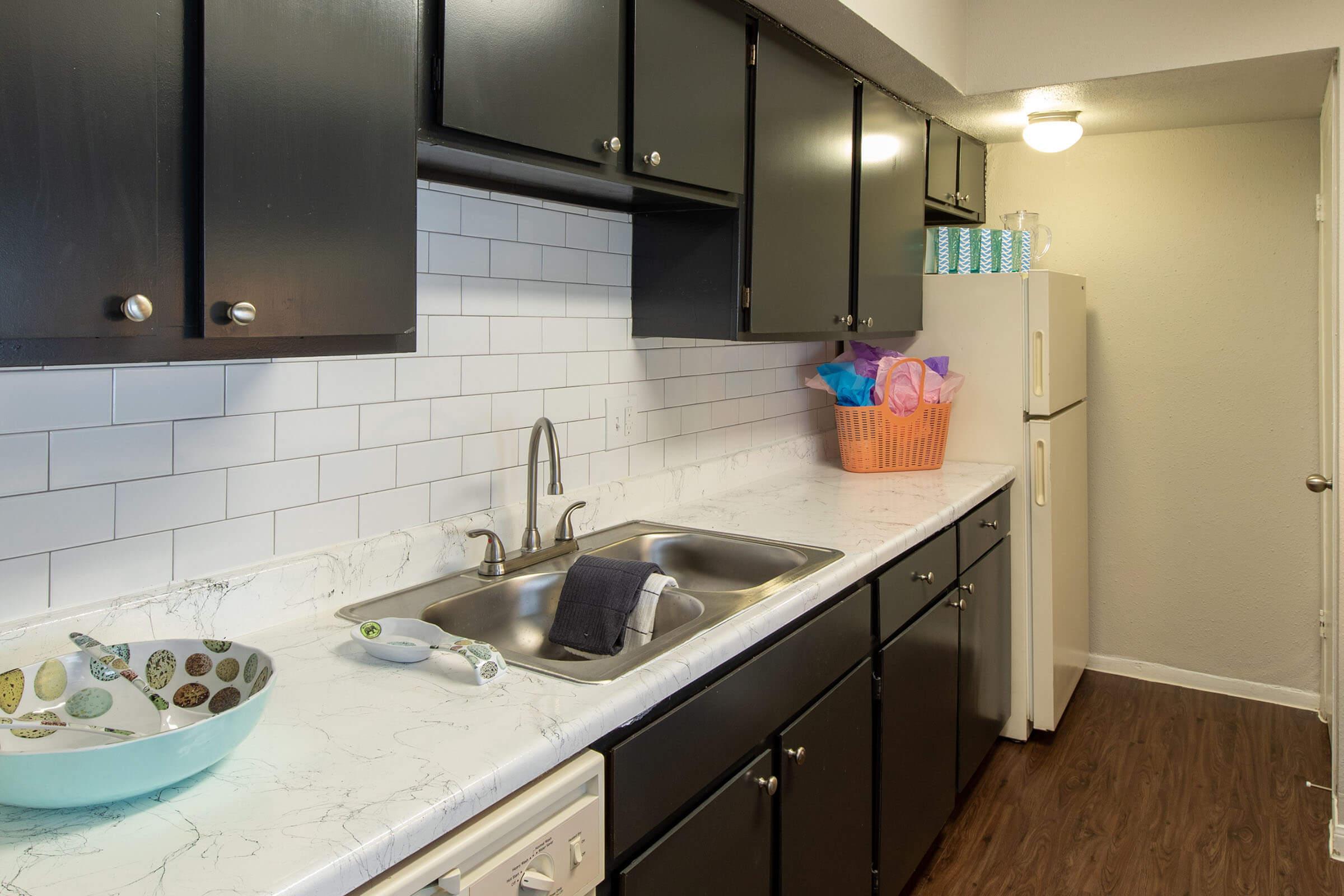 a kitchen with a stove and a sink