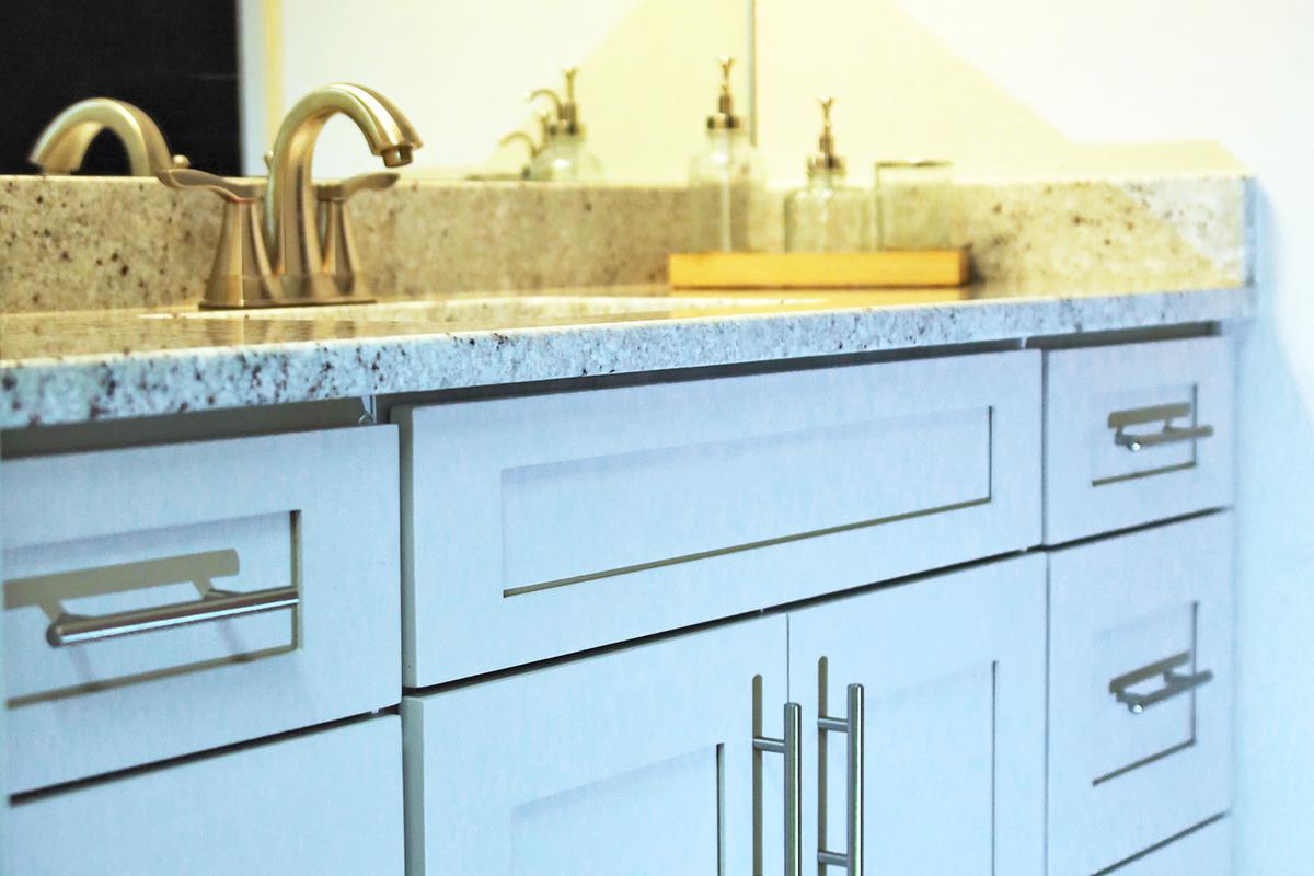 a stove top oven sitting inside of a kitchen