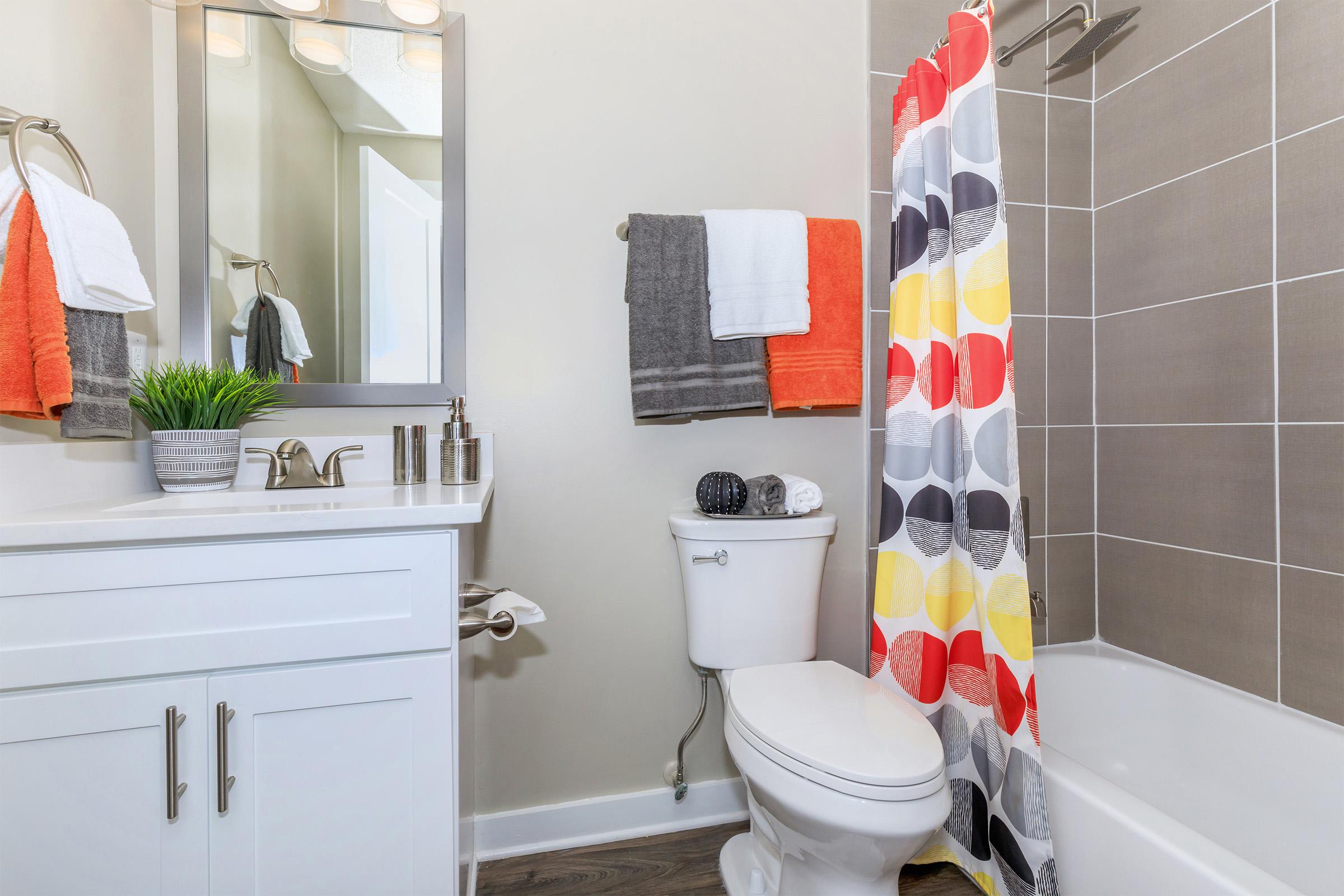 a white tub sitting next to a sink