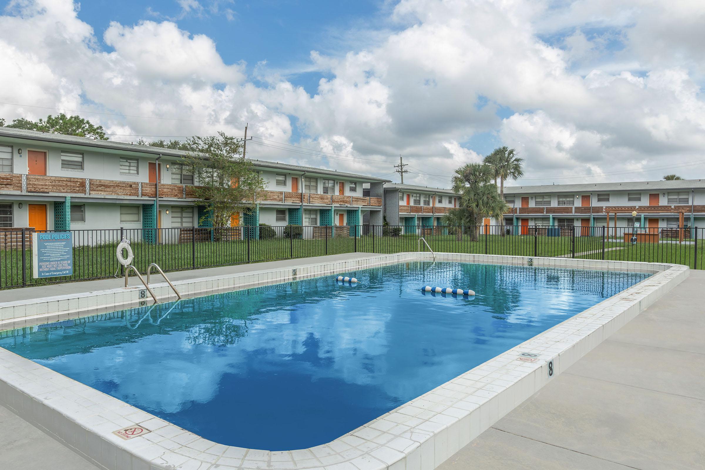 a pool next to a body of water