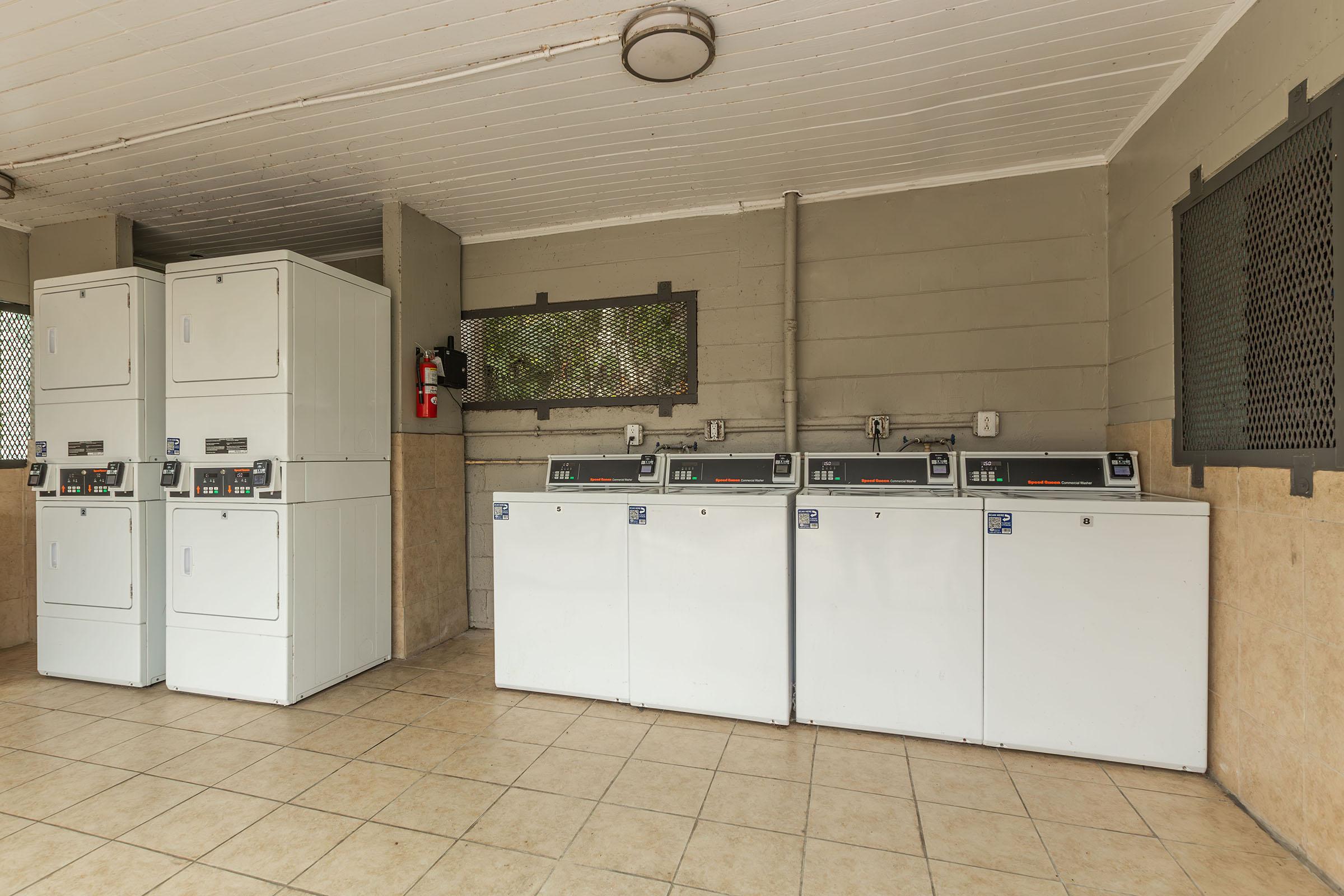 a kitchen with a stove and a refrigerator