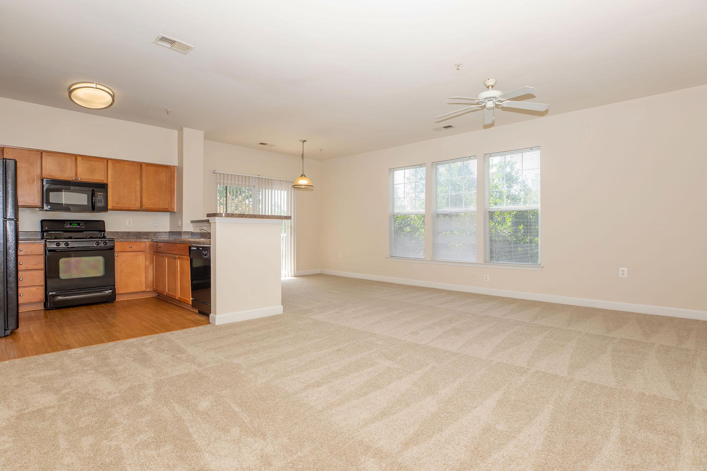 a living room filled with furniture and a flat screen tv