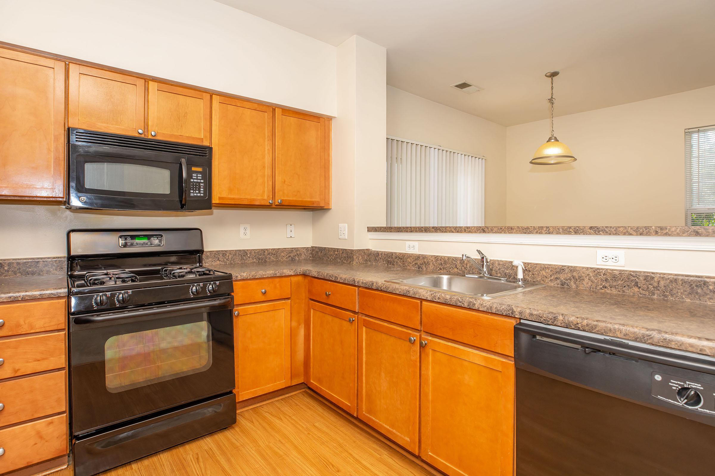 a kitchen with a stove and a microwave