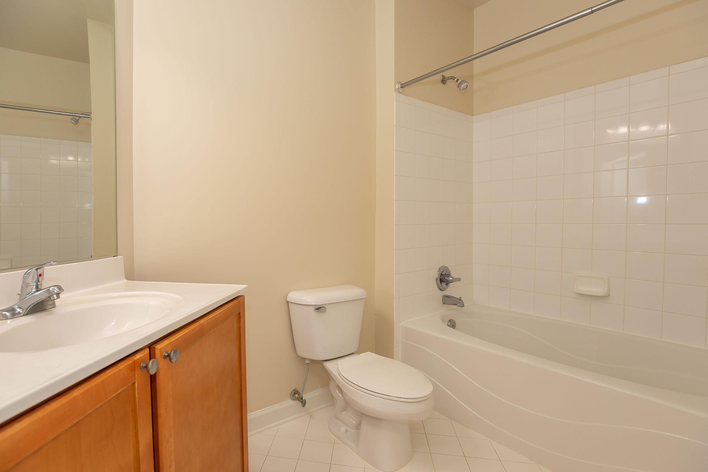 a room with a sink and a bath tub