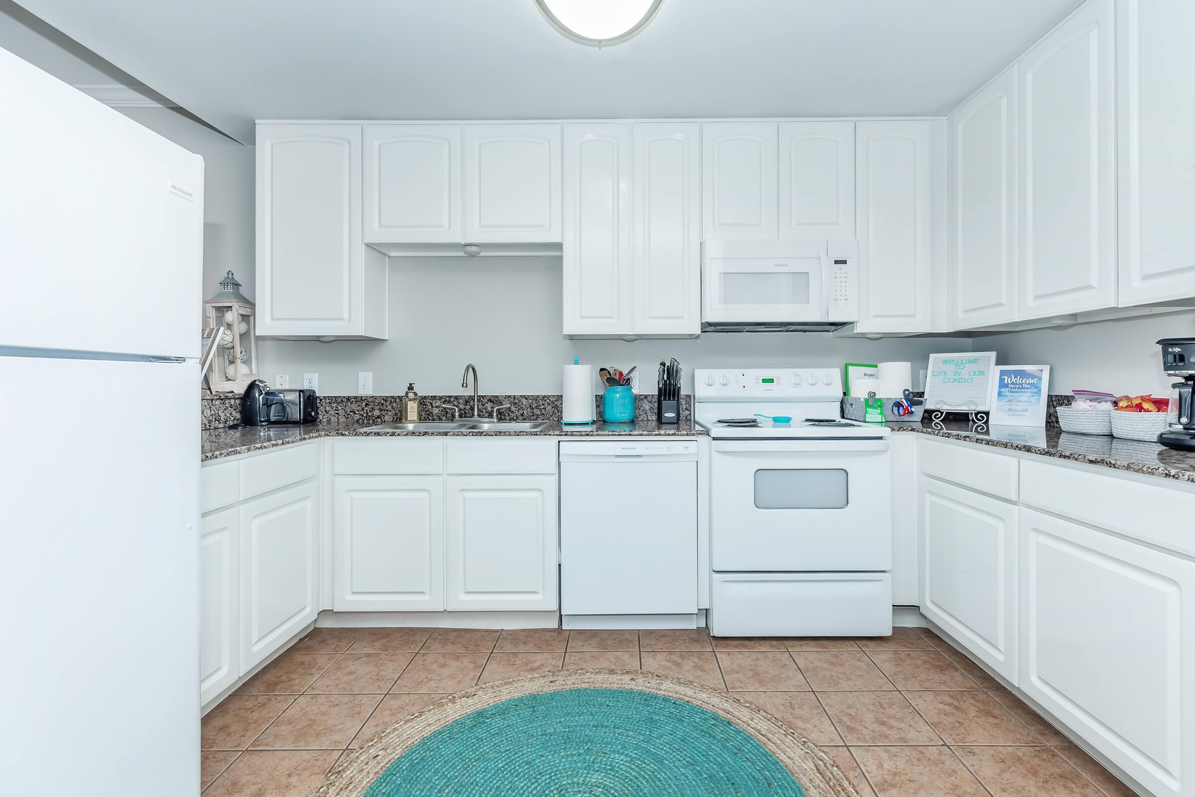 a kitchen with a stove and a refrigerator