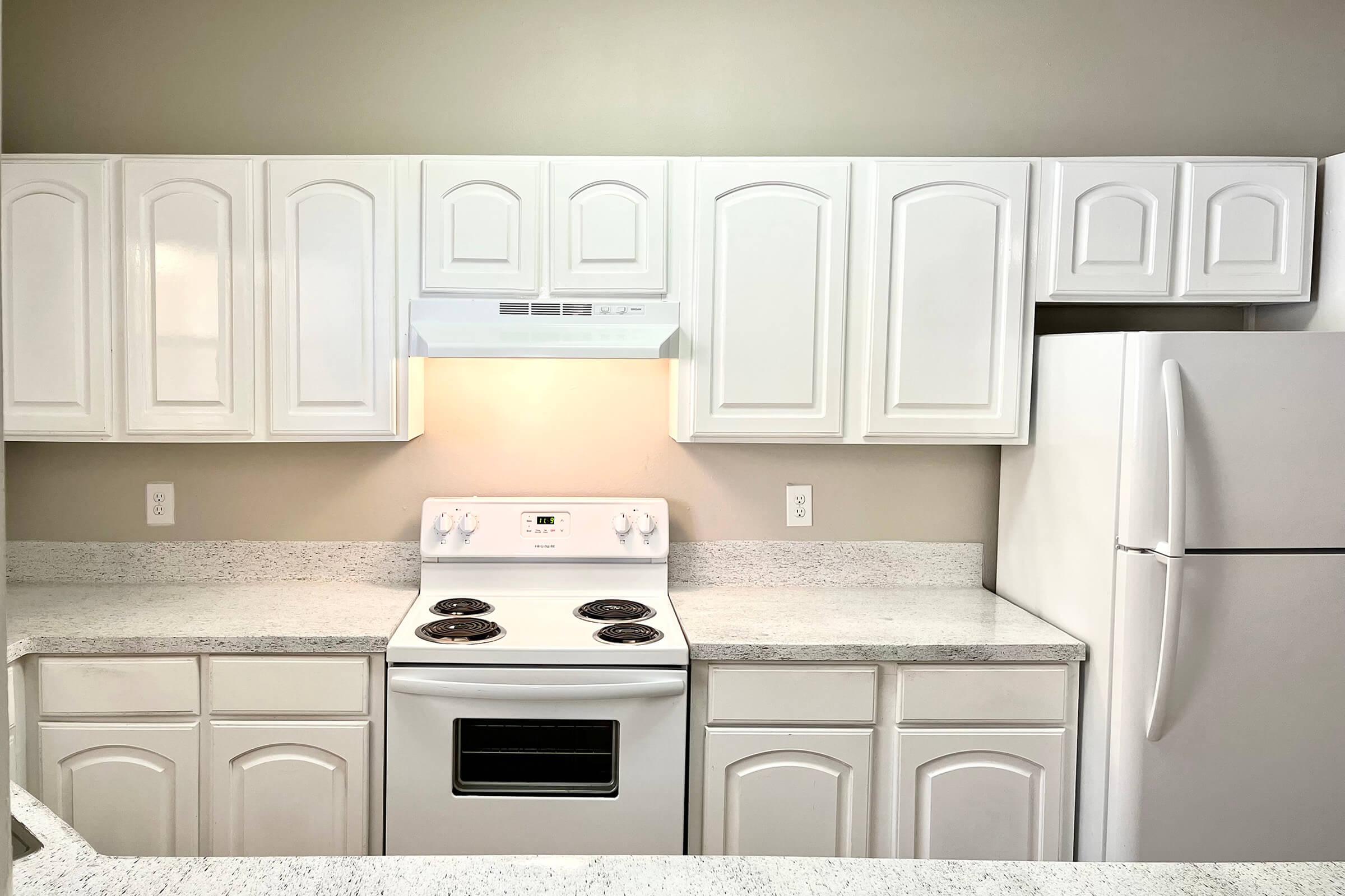 a kitchen with a stove and a microwave