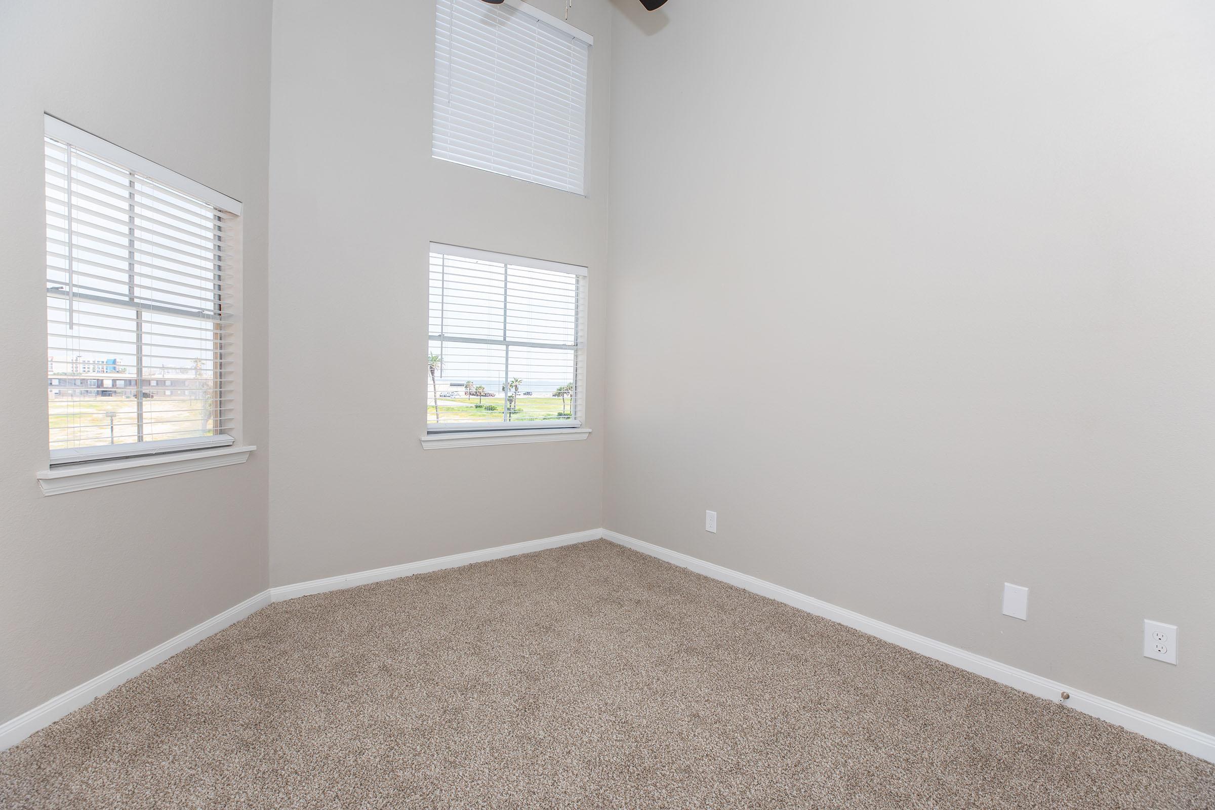 a bedroom with a large window