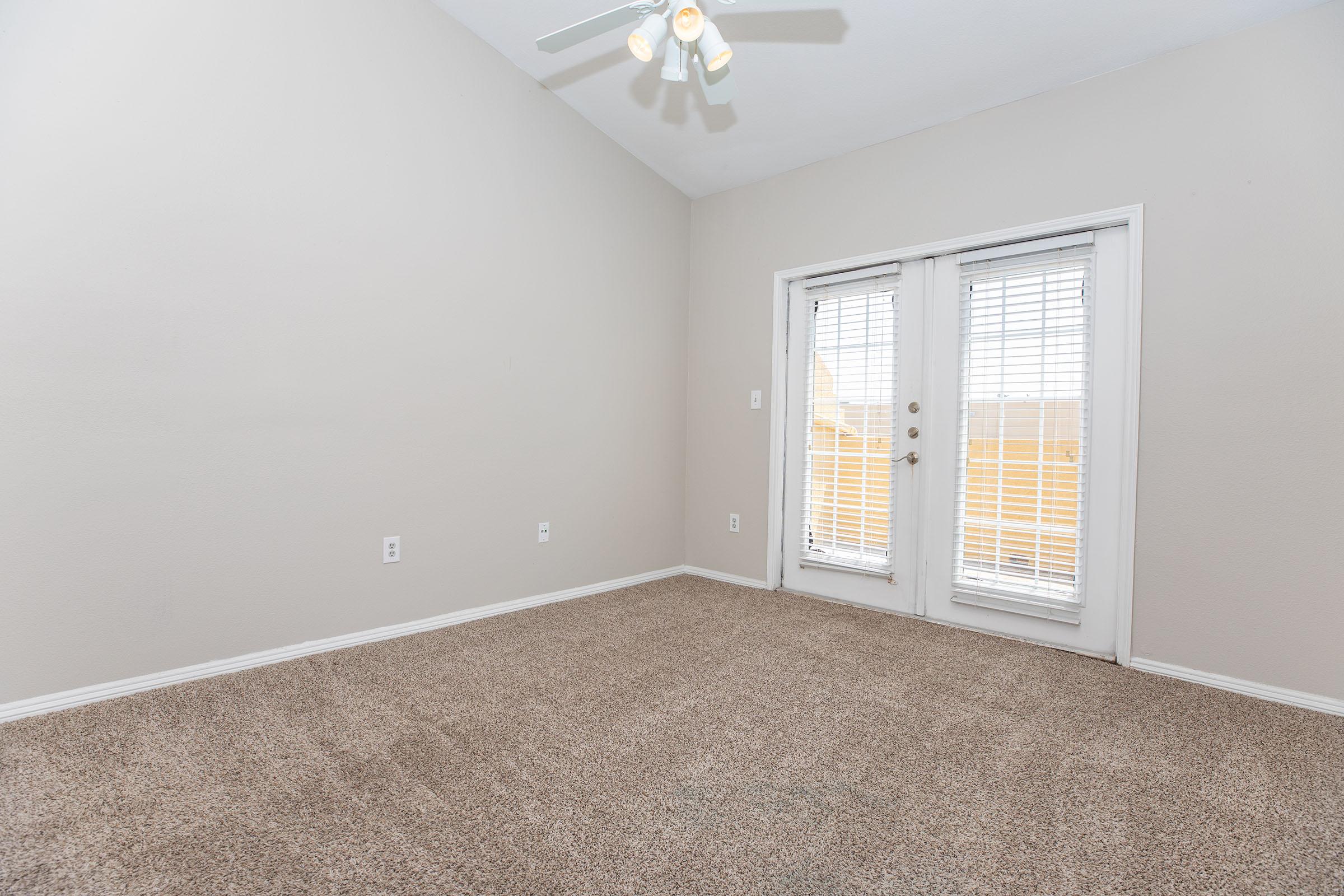 a bedroom with a large window