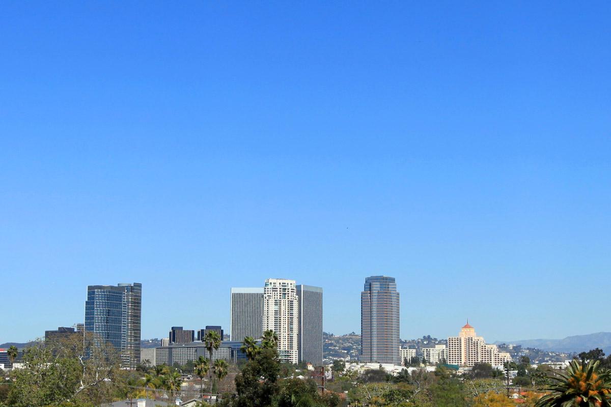 a large body of water with a city in the background