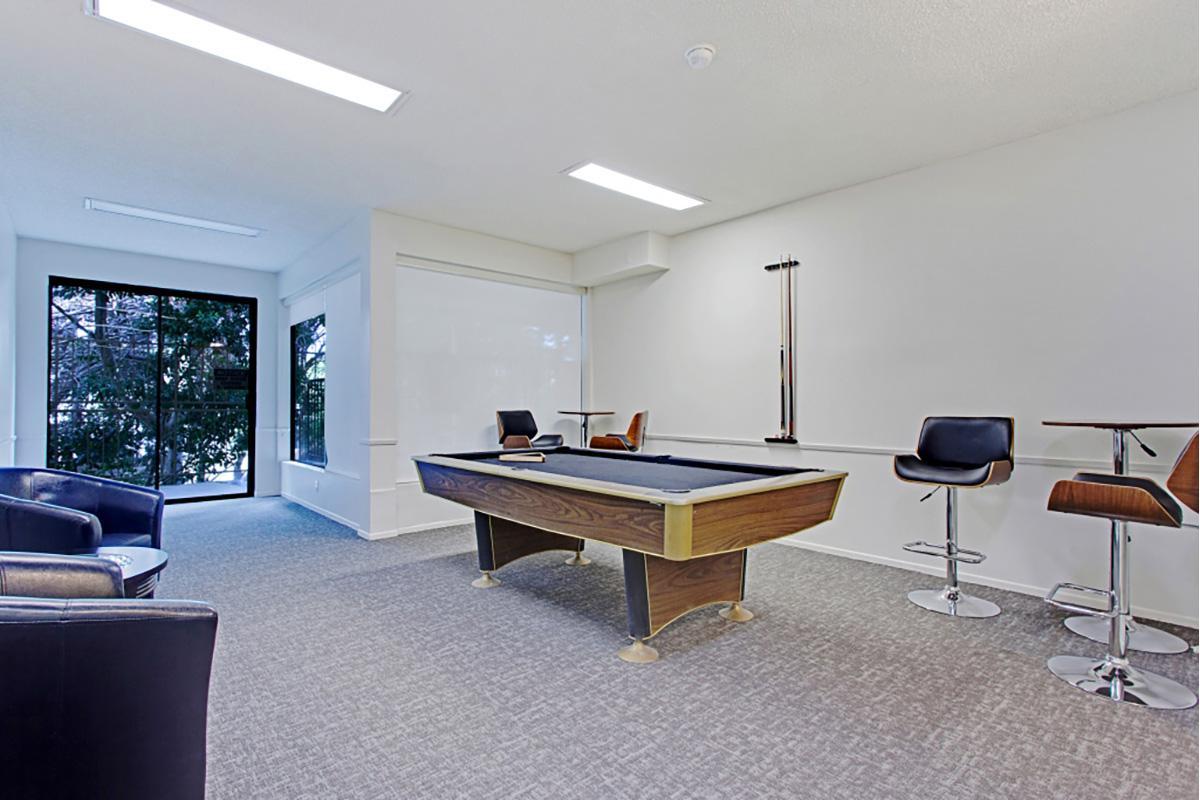 a living room filled with furniture and a flat screen tv